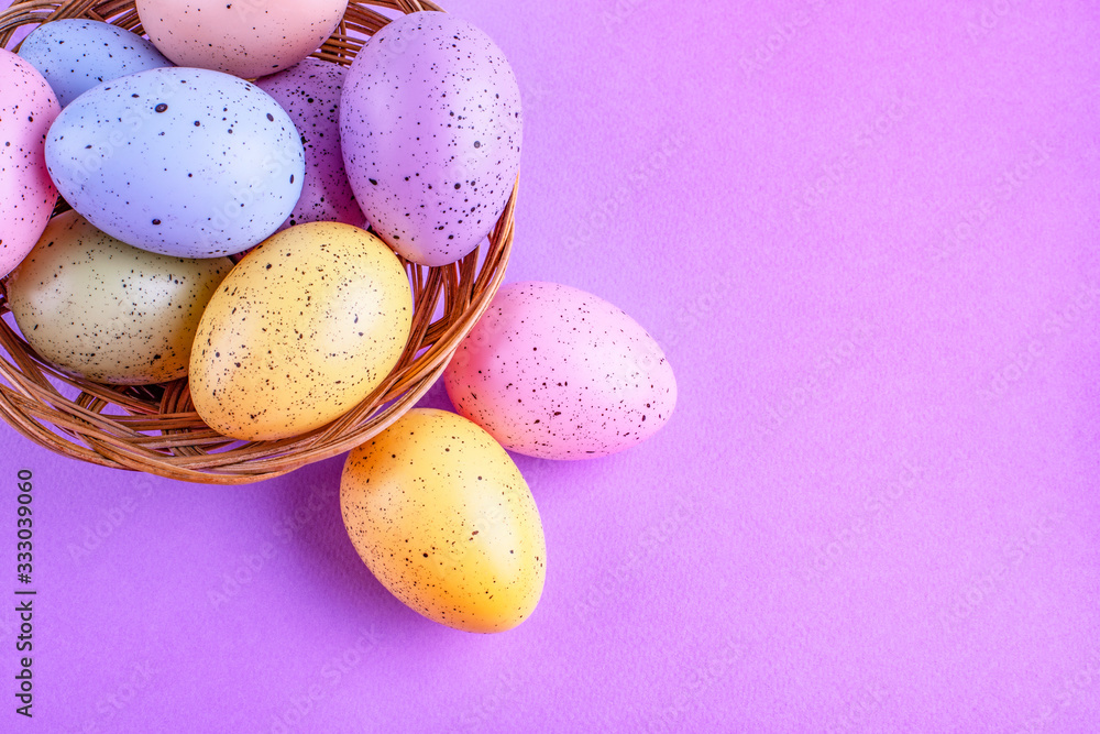 Easter multi-colored eggs on a lilac background