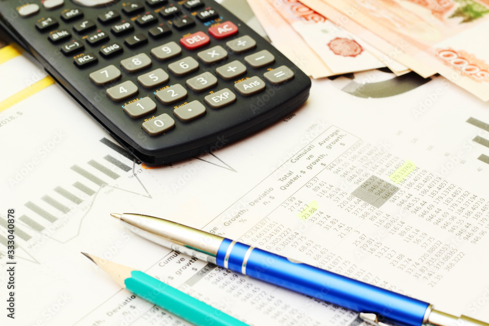 Business concept with a report and a calculator Business concept with a report and a calculator