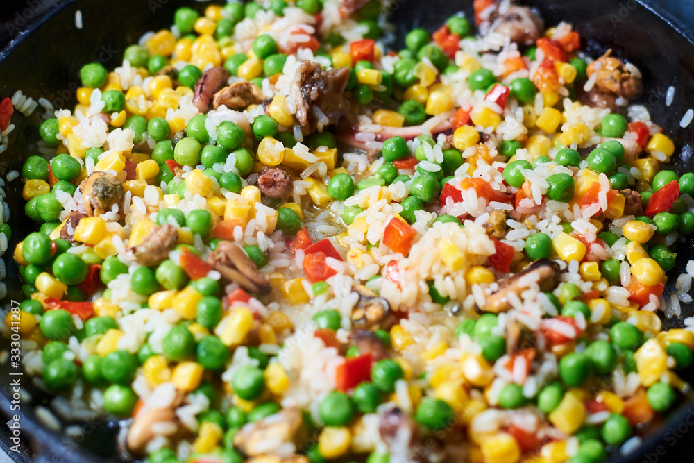 Fry vegetables in a pan. A mixture of different vegetables. Fry vegetables in a pan. A mixture of different vegetables.