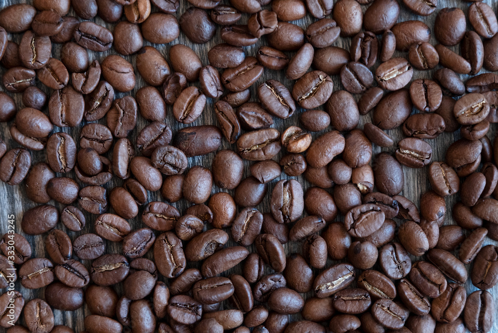 Coffee beans on a wooden table, top view. Coffee beans on a wooden table, top view.