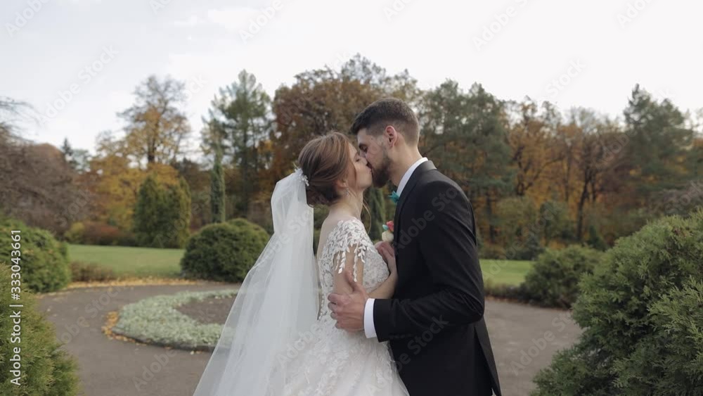 Newlyweds. Caucasian groom with bride in the park. Wedding couple. Happy family Newlyweds. Caucasian groom with bride in the park. Wedding couple. Happy family