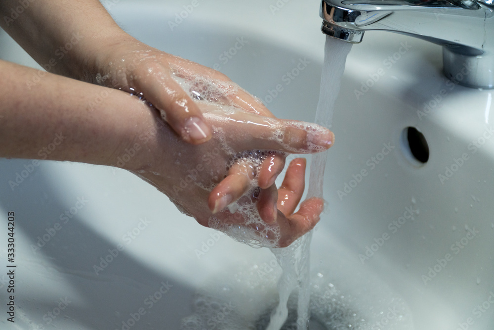 Fototapeta premium Woman's Hands Cleaned In Sink