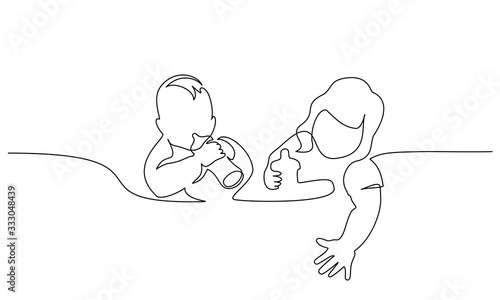 Two joyful children are eating from bottles