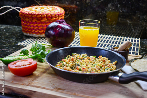 Photos Traditional Mexican style scrambled egg made with onion, jalapeno and tomato