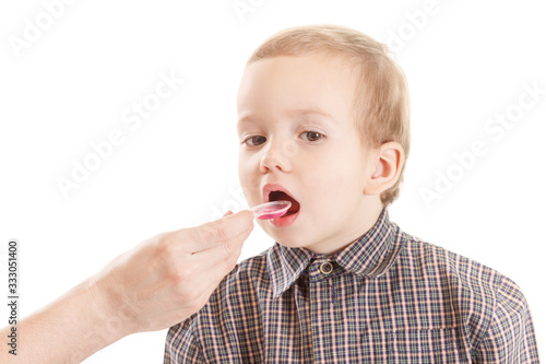 Pediatrician examining little child throat