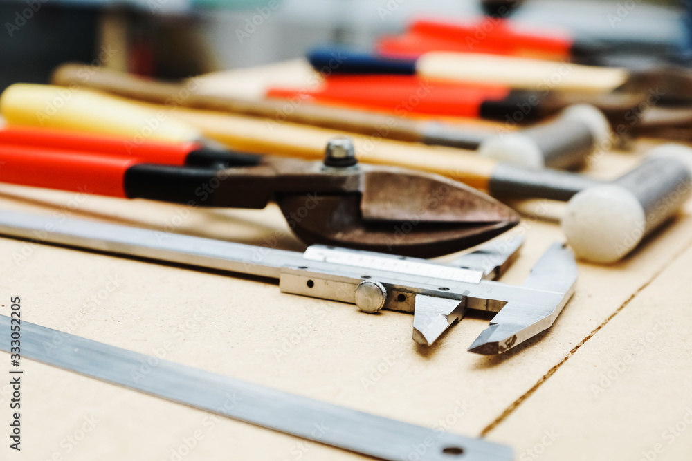 construction tools lie neatly on the table. calipers construction tools lie neatly on the table. calipers