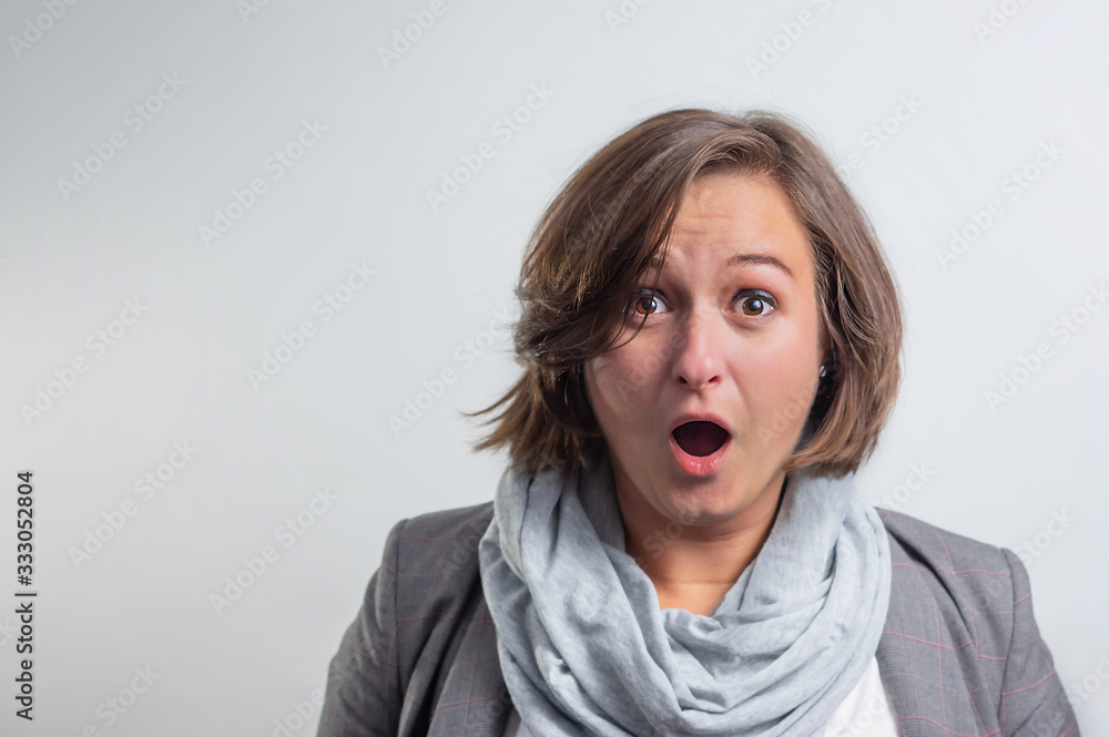 Portrait of a business woman looking surprised Portrait of a business woman looking surprised