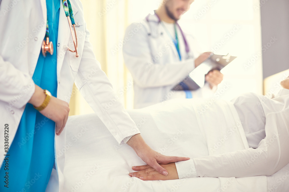 doctor or nurse talking to patient in hospital doctor or nurse talking to patient in hospital