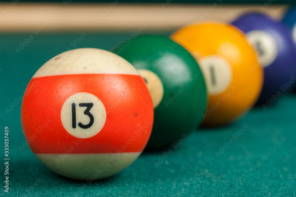 Billiards balls and cue on billiards table. Billiard sport concept. Billiards balls and cue on billiards table. Billiard sport concept.