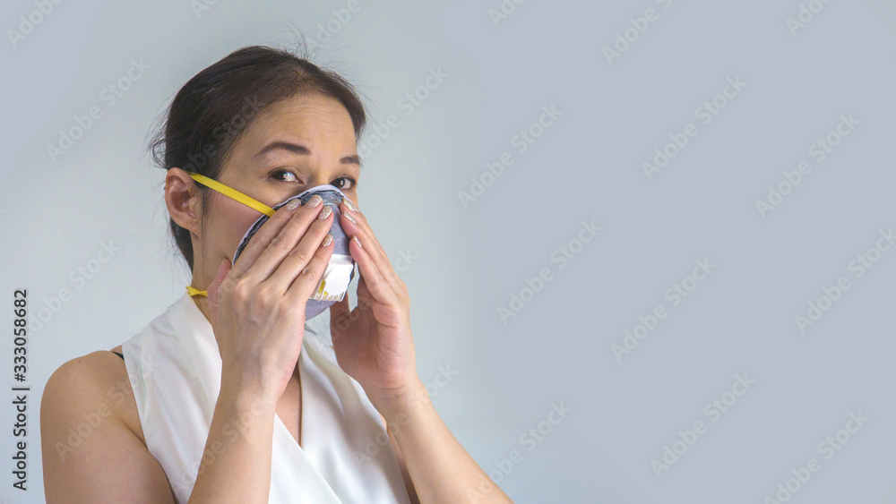 Asian woman wearing mask for protect Coronavirus and Air pollution pm2.5 or allergy. Asian woman wearing mask for protect Coronavirus and Air pollution pm2.5 or allergy.