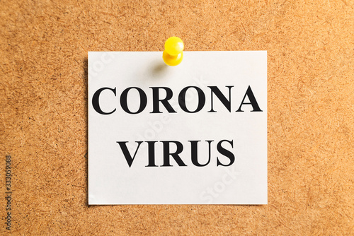 White sticker for notes with the inscription "CORONA VIRUS". horizontal frame