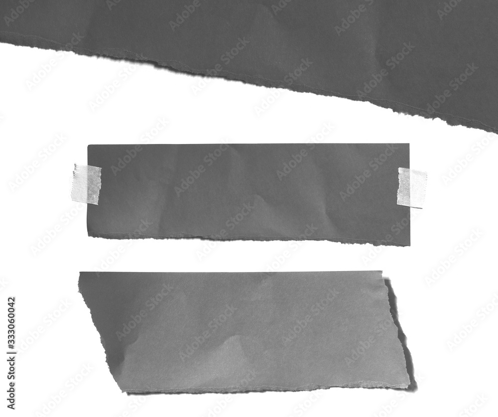 Old black ripped paper isolated on white background with copy space for text Old black ripped paper isolated on white background with copy space for text