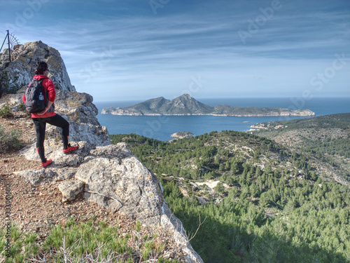 Female hiker enjoy walk via island of Mallorca, Spain.