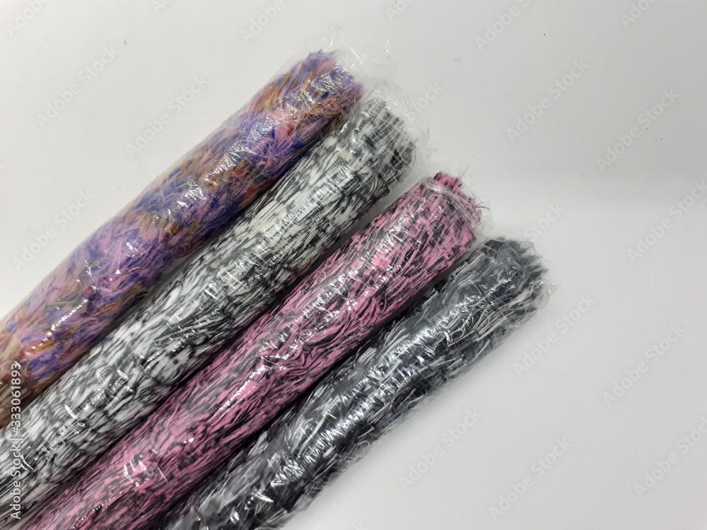 Fototapeta premium Colorful Fluffy Cute Feather Duster Synthetic Fabric Materials for Home Interior Cleaning Tools in White Isolated Background