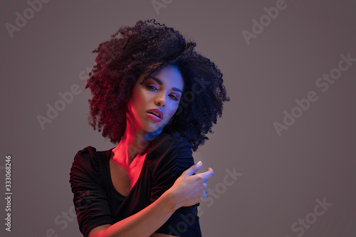 Beautiful afro woman posing in studio.