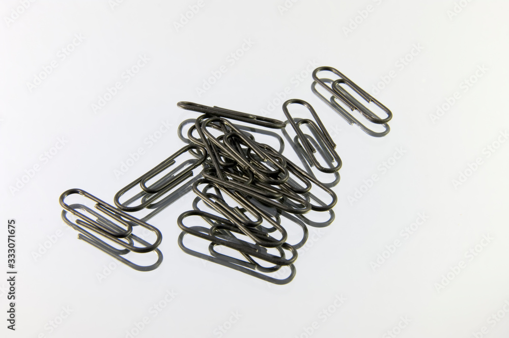 paper clip isolated on mirror paper clip isolated on mirror