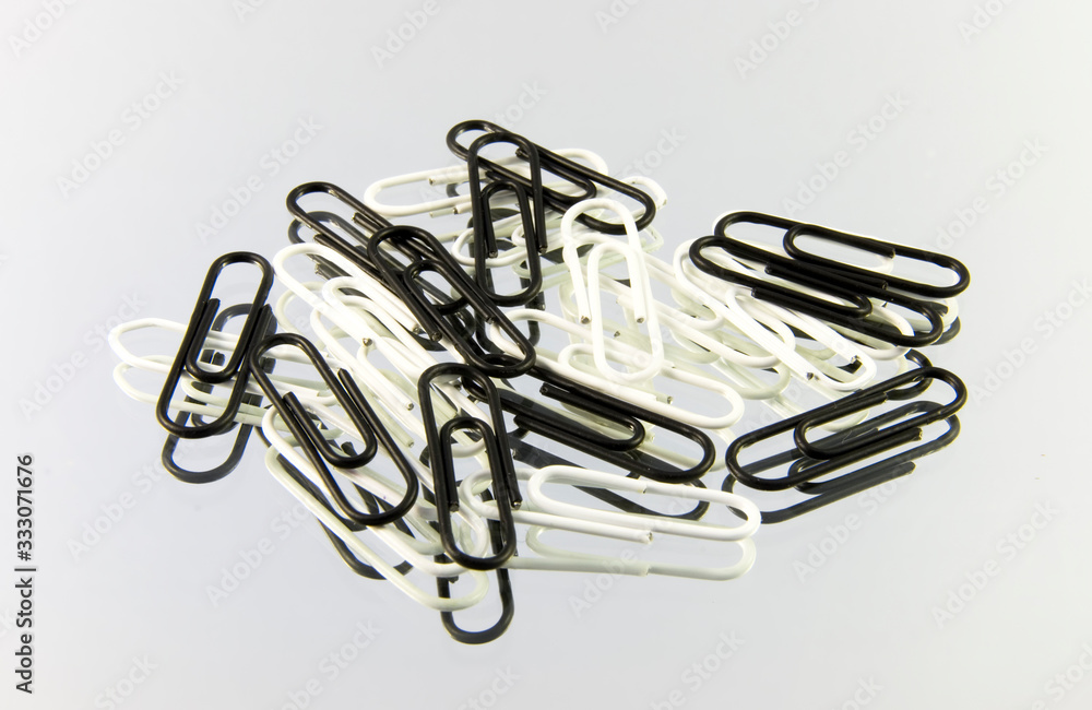 paper clip isolated on mirror paper clip isolated on mirror