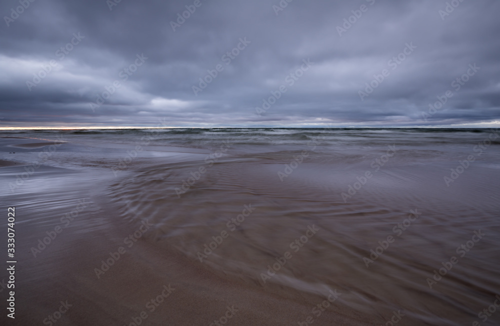 Sunset at the beach photographed with long exposure Sunset at the beach photographed with long exposure