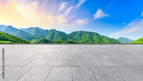 Empty square floor and green tea mountain nature landscape at sunset panoramic view.