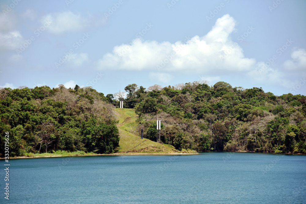 Green landscape of Panama Canal, view from the transiting cargo ship. Green landscape of Panama Canal, view from the transiting cargo ship.