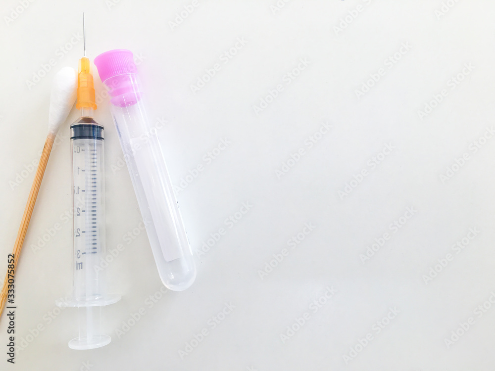 blood collection tube and syringe and swab with copy space in healthcare check uo concept blood collection tube and syringe and swab with copy space in healthcare check uo concept