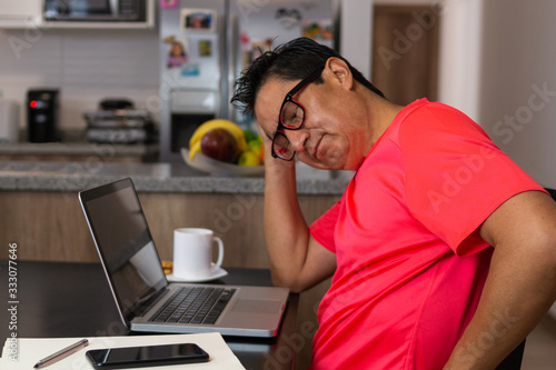 Worried man working at home