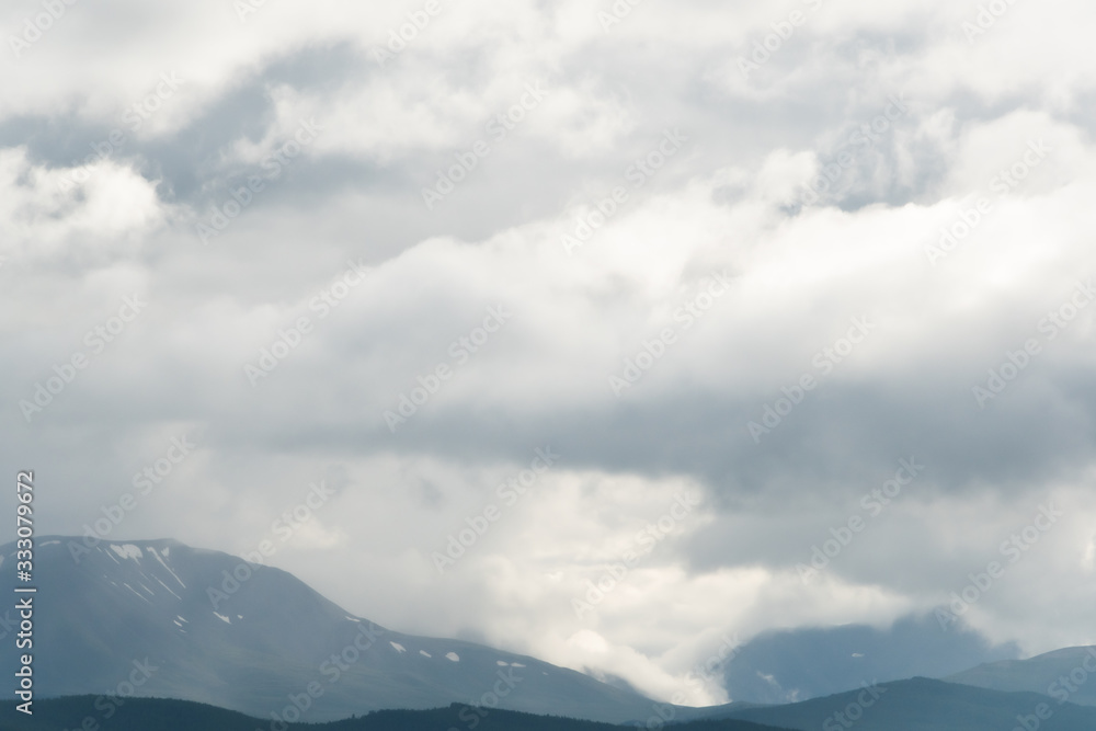 thick clouds over rock ridge, bad weather and waiting for rain in  mountains