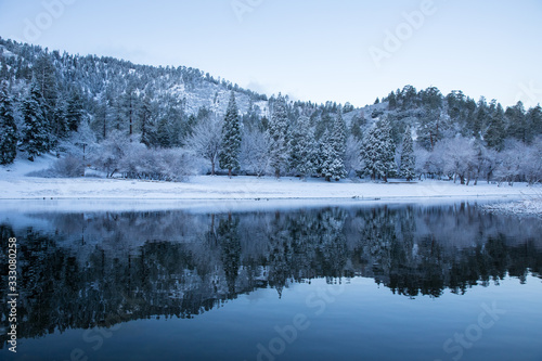 winter landscape with lake and forest © Attila Adam