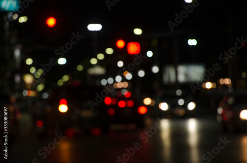 Beautiful blurry lights of vehicles on the road in city