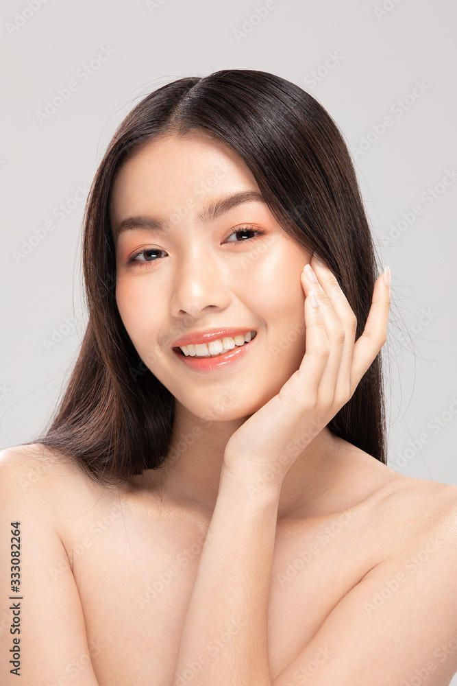 Beautiful Asian woman touching soft cheek smile with clean and fresh skin Happiness and cheerful with positive emotional,isolated on white background,Beauty and Cosmetics Concept Beautiful Asian woman touching soft cheek smile with clean and fresh skin Happiness and cheerful with positive emotional,isolated on white background,Beauty and Cosmetics Concept