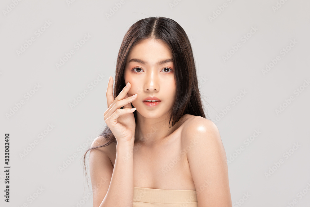 Beautiful Asian woman touching soft cheek smile with clean and fresh skin Happiness and cheerful with positive emotional,isolated on white background,Beauty and Cosmetics Concept Beautiful Asian woman touching soft cheek smile with clean and fresh skin Happiness and cheerful with positive emotional,isolated on white background,Beauty and Cosmetics Concept