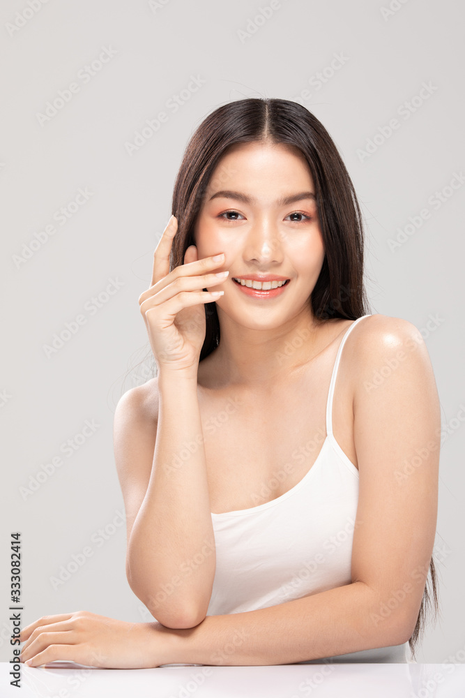 Beautiful Asian woman touching soft cheek smile with clean and fresh skin Happiness and cheerful with positive emotional,isolated on white background,Beauty and Cosmetics Concept Beautiful Asian woman touching soft cheek smile with clean and fresh skin Happiness and cheerful with positive emotional,isolated on white background,Beauty and Cosmetics Concept