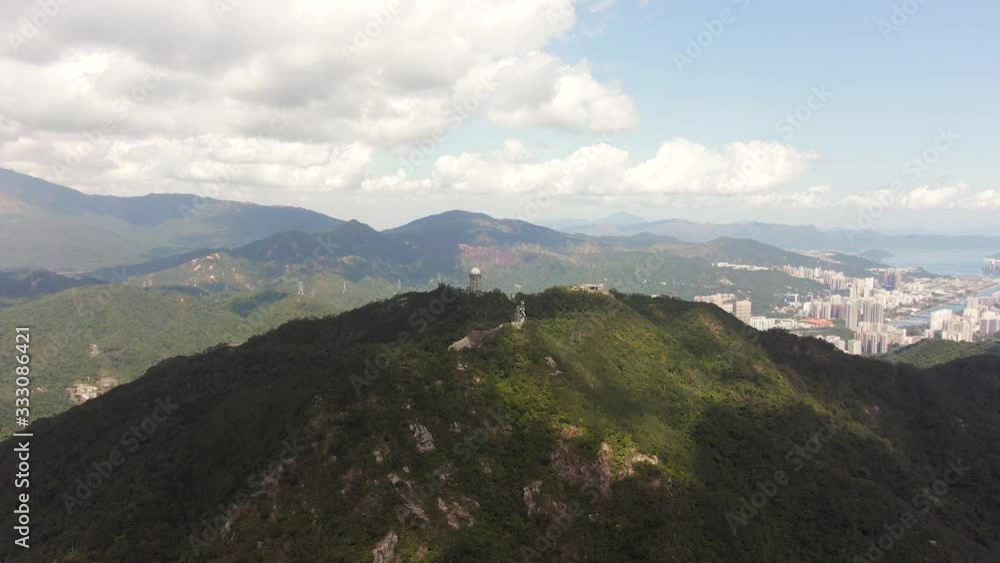 One minute Aerial approach view of Massive Antenna towers on Lion Rock mountains, Hong Kong. One minute Aerial approach view of Massive Antenna towers on Lion Rock mountains, Hong Kong.