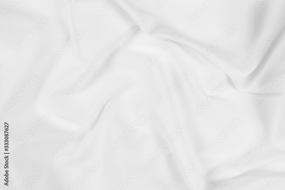 Abstract white fabric texture background. Cloth soft wave. Creases of satin, silk, and cotton.	