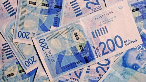200 NIS Israeli shekel notes rotating in frame 4k studio shot