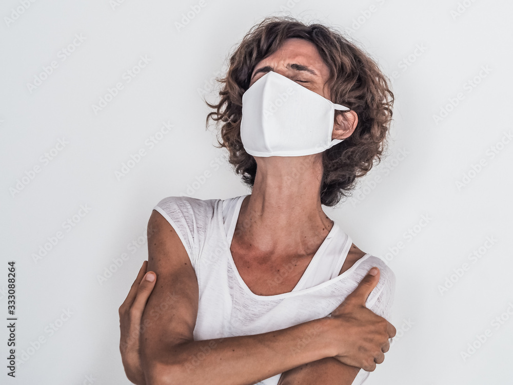 lonely sad and depressed woman wearing a white medical face mask