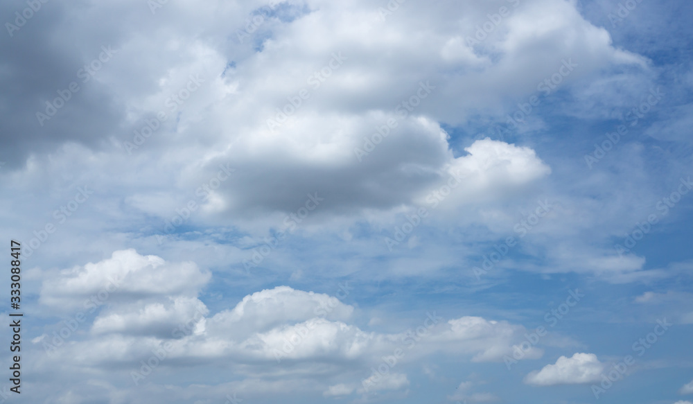 Beautiful white fluffy clouds formation on vivid blue sky know as raincloud