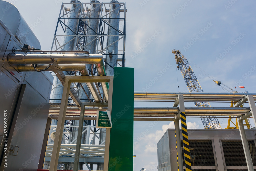 Stacks of exhaust funnel with processing facilities on a oil production platform Stacks of exhaust funnel with processing facilities on a oil production platform