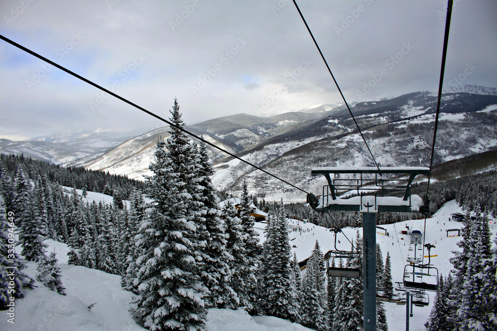Empty ski lift looking towards valley in Vail Colorado