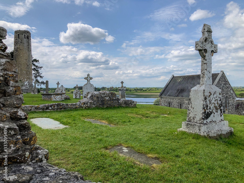 View of cemetery at the Clonmacnoise historic monastery ruins in County Offaly, Ireland photo