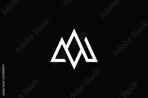 Minimal elegant monogram art logo. Outstanding professional trendy awesome artistic MN NM initial based Alphabet icon logo. Premium Business logo White color on black background