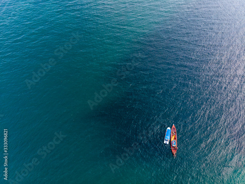 small boat and clear sea © Keerathi