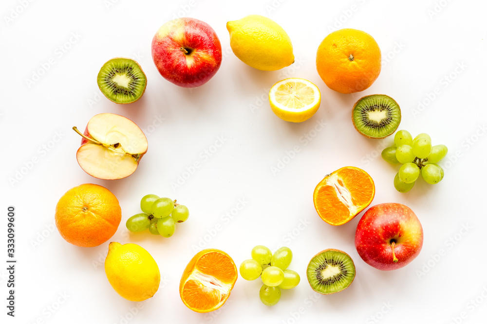 Colorful fruit mockup. Cut apple, kiwi, citrus on white background top-down copy space Colorful fruit mockup. Cut apple, kiwi, citrus on white background top-down copy space