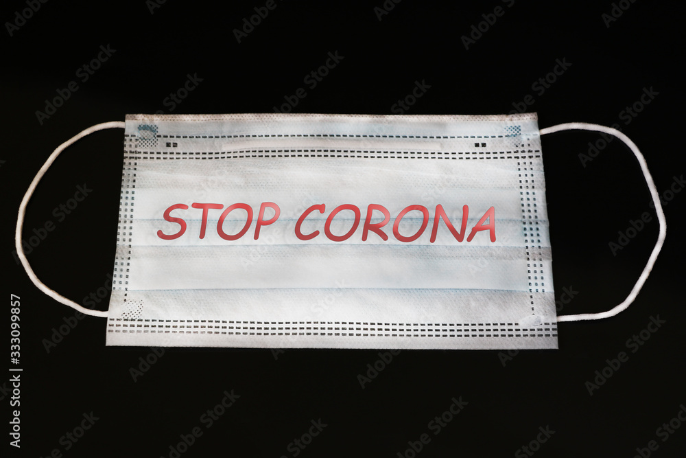 Medical mask on a black background from respiratory illness. Remedy for illness. Coronavirus. Pandemic around the world. Medical mask on a black background from respiratory illness. Remedy for illness. Coronavirus. Pandemic around the world.