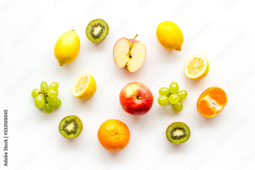 Colorful summer fruits background on white table top view Colorful summer fruits background on white table top view
