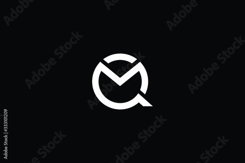 Minimal elegant monogram art logo. Outstanding professional trendy awesome artistic QM MQ initial based Alphabet icon logo. Premium Business logo White color on black background photo