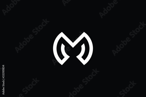 Minimal elegant monogram art logo. Outstanding professional trendy awesome M MO OM initial based Alphabet icon logo. Premium Business logo White color on black background