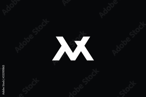 Minimal elegant monogram art logo. Outstanding professional trendy awesome artistic M MV VM initial based Alphabet icon logo. Premium Business logo White color on black background