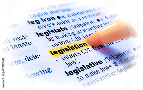 A close up of the word: LEGISLATION in a dictionary, highlighted in yellow and showing part of its definition.	