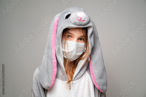 Photography teen in kigurumi in medical mask. close up